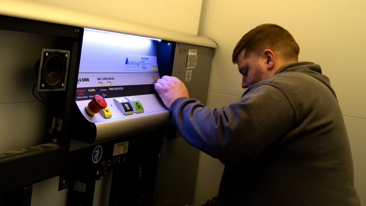 Harry Reed working on a platform lift control panel